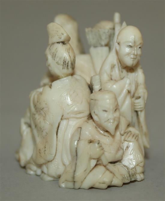 A Japanese small ivory okimono of six immortals, 3.3cm